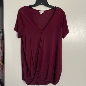 Maroon short sleeve shirt with slit in the middle